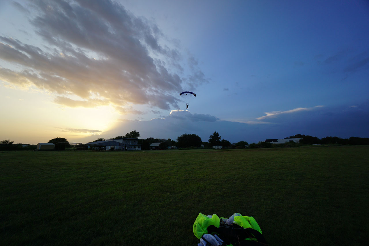 licensed skydiver coming in for a landing at sunset at Texas Skydiving near Austin and College Station, TX